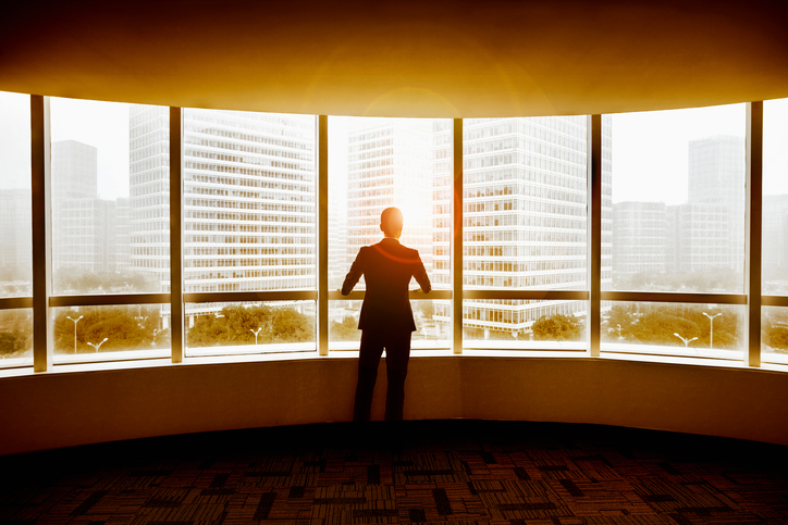 a businessman looking outside the window